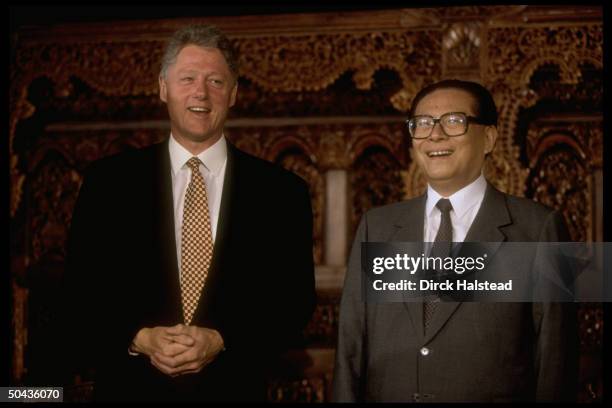 Pres. Bill Clinton chatting w. Chinese Pres. Jiang Zemin during Asia-Pacific Economic Cooperation summit.