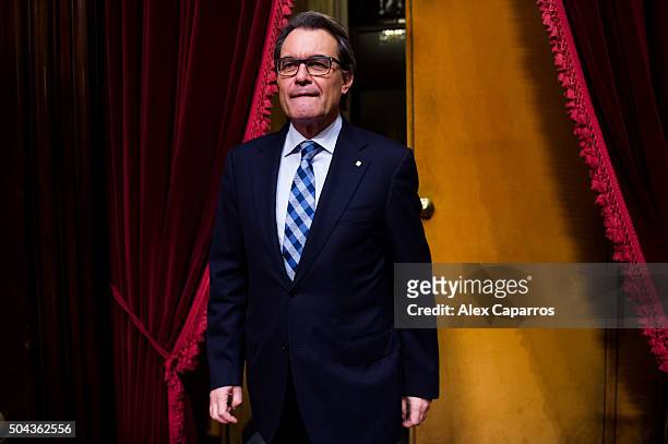 Acting President of Catalonia Artur Mas walks through the Parliament during the parliamentary session debating on electing Carles Puigdemont as the...