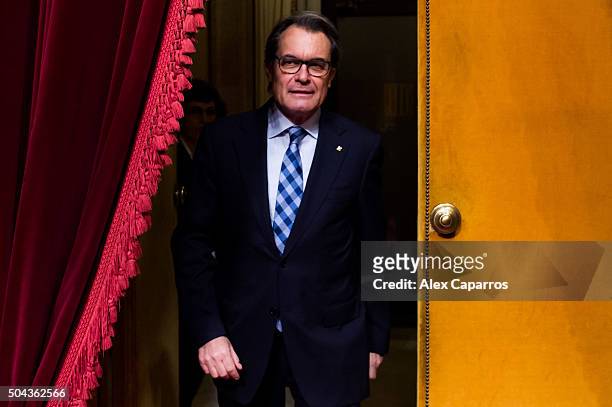 Acting President of Catalonia Artur Mas walks through the Parliament during the parliamentary session debating on electing Carles Puigdemont as the...