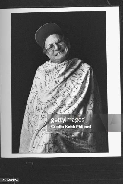 Autograph collector Walter Light wrapped in his mother's Irish linen tablecloth covered w. Autographs of famous people which she embroidered over to...