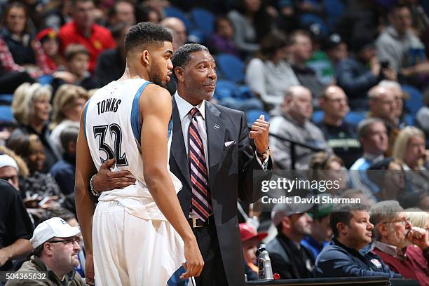 Head coach Sam Mitchell of the Minnesota Timberwolves and Karl-Anthony Towns of the Minnesota Timberwolves talk during the game against the Dallas...