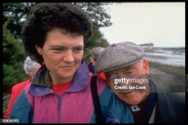 Podiatrist Jenny Cockell who claims to have been housewife Mary Sutton in a past life, walking w. Mary's son Christy outdoors.