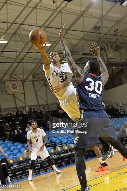 January 10 : Keith Appling of the Erie BayHawks with the layup around Kyle Casey of the Bakersfield Jam at the Kaiser Permanente Arena in Santa Cruz,...