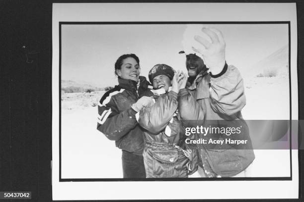 Olympic skier Picabo Street in a squeeze play between her bro. Baba who is threatening to slap a handful of snow in her face & her friend Tara Bell...