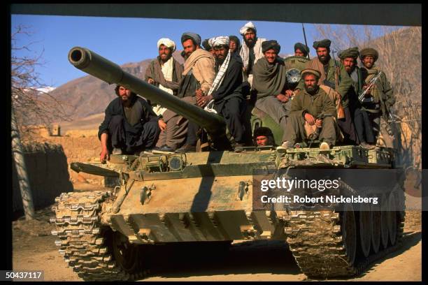 Taliban fighters w. Tank at HQ taken fr. Opposition Hekmatyar mujahedin by radical Islamic cleric-led faction on top in civil war, nr. Govt-held...