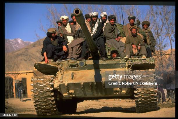 Taliban fighters w. Tank at HQ taken fr. Opposition Hekmatyar mujahedin by radical Islamic cleric-led faction on top in civil war, nr. Govt-held...