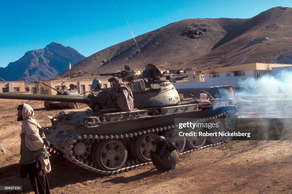 Taliban fighters w. tanks at HQ taken fr