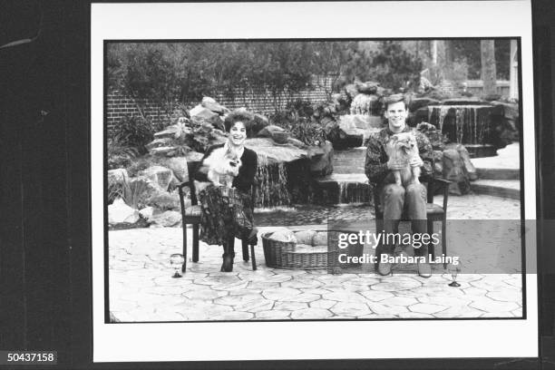 Gymnast Mary Lou Retton, '84 Olympic gold medalist, w. Her husband, ex-Univ. Of Texas football QB Shannon Kelly, each w. One of their Pomeranian dogs...