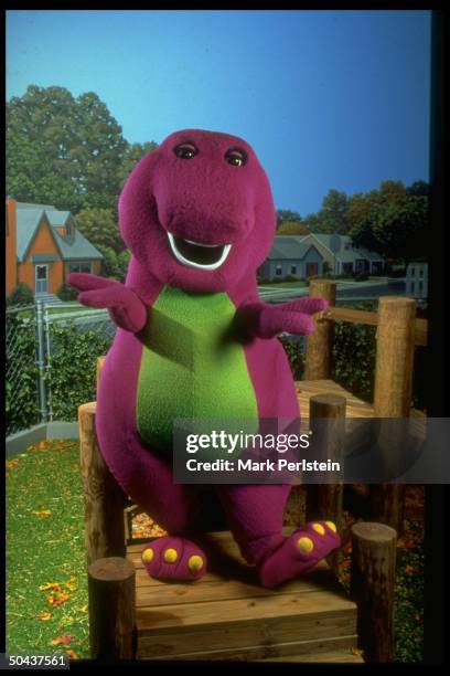 Barney, the purple dinosaur, in scene fr. PBS TV series Barney & Friends.