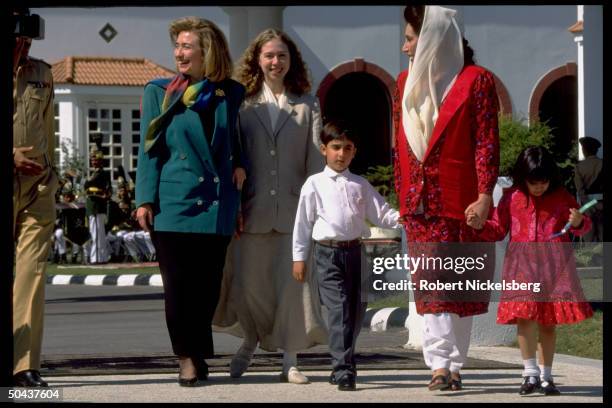 1st Lady Hillary Rodham Clinton & daughter Chelsea out strolling w. PM Benazir Bhutto & children Benazir & Bilawal, on Asian tour stop in Islamabad,...