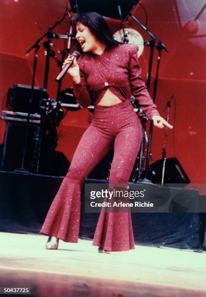 Mexican singer Selena performing in concert; one month later she would be shot and killed by Yolanda Saldivar, the pres. Of her fan club, after...