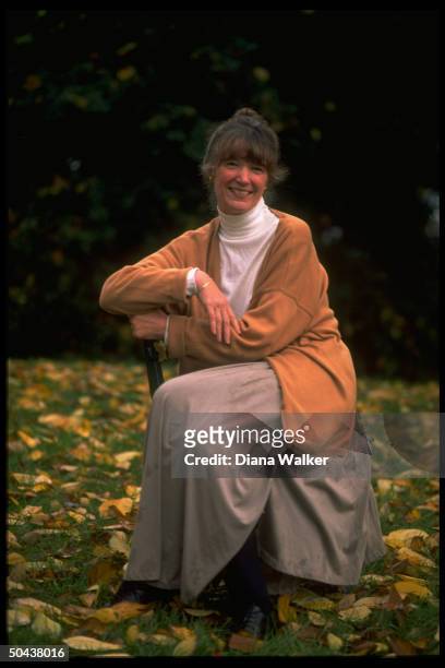 Author Anne Tyler in sylvan setting , prob. At home.