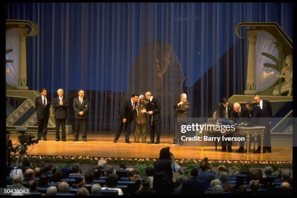 Israel/PLO peace agreement signing ceremony Moussa, Peres, Kozyrev, Mubarak, Arafat & Christopher, w. Rabin at far R, signing.