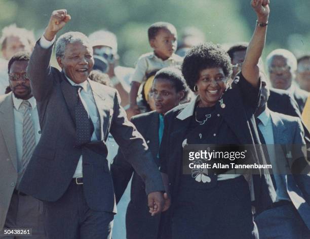 Ldr. Nelson Mandela and wife Winnie raising fists upon his release from Victor Verster prison after 27 yrs.