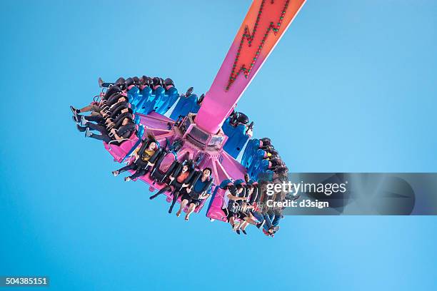 people having fun on the flash in theme park - theme park ride stock pictures, royalty-free photos & images