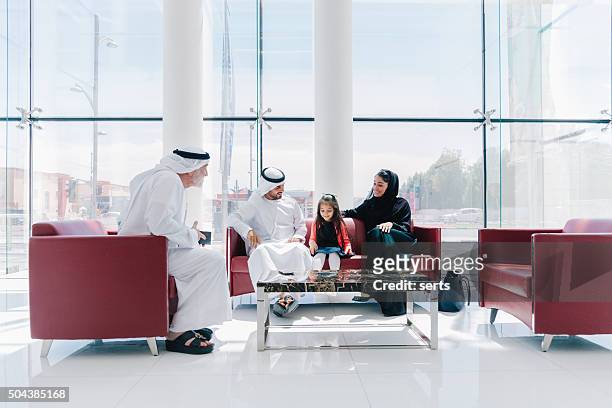 traditional  arabic family enjoying at lounge - catering building stock pictures, royalty-free photos & images