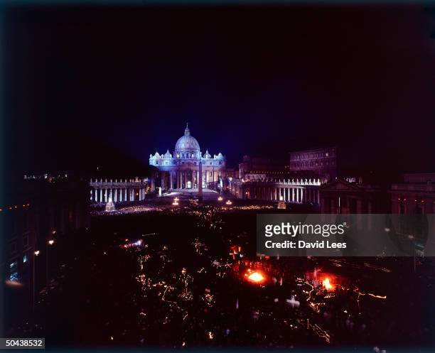Aerial view of St. Peter's Cathedral and the Vatican at night, showing a candle lit procession during coronation of Pope John Paul XXIII, Rome,...