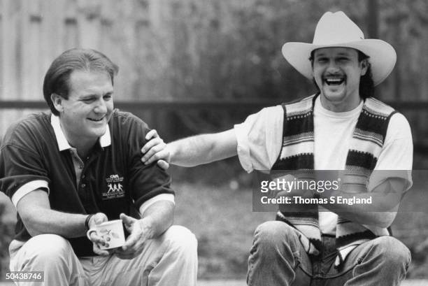 Musician Tim McGraw w. Father, former baseball player Tug McGraw, as they sit outside nr. His home.