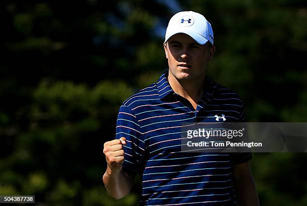 Jordan Spieth reacts after putting for birdie on the second green during the final round of the Hyundai Tournament of Champions at the Plantation...
