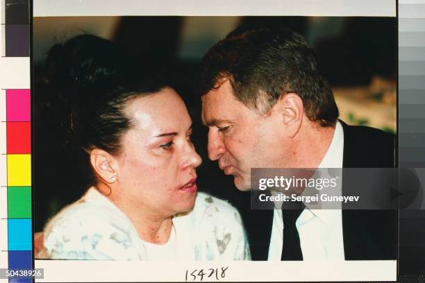 Vladimir & Galina Zhirinovsky moving to kiss, taking quiet moment together during fete celebrating strong showing of his ultranationalist Liberal...