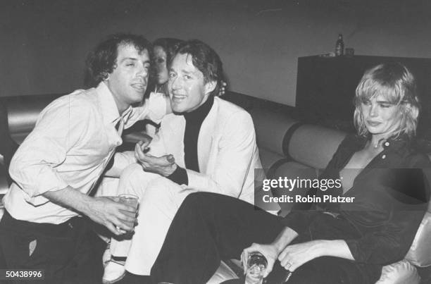 Studio 54 disco owner Steve Rubell, fashion designer Halston and model/actress Margaux Hemingway sitting in the Mike Todd Room w. Drinks in hand at...