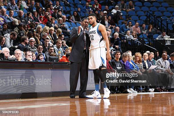 Head coach Sam Mitchell of the Minnesota Timberwolves and Karl-Anthony Towns of the Minnesota Timberwolves talk during the game against the Dallas...