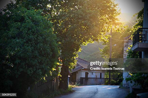 small road in a greek village - kataraktis village stock pictures, royalty-free photos & images