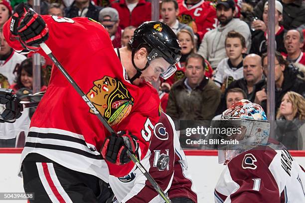 Brandon Mashinter of the Chicago Blackhawks hits the puck to score on goalie Semyon Varlamov of the Colorado Avalanche in the first period of the NHL...