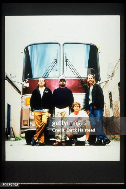 Dean Felber, Darius Rucker, Mark Bryan & Jim Sonefeld of rock band Hootie and the Blowfish in front of their tour bus.