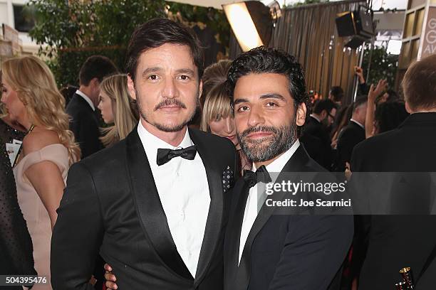 Actors Pedro Pascal and Oscar Isaac attend the 73rd Annual Golden Globe Awards held at the Beverly Hilton Hotel on January 10, 2016 in Beverly Hills,...