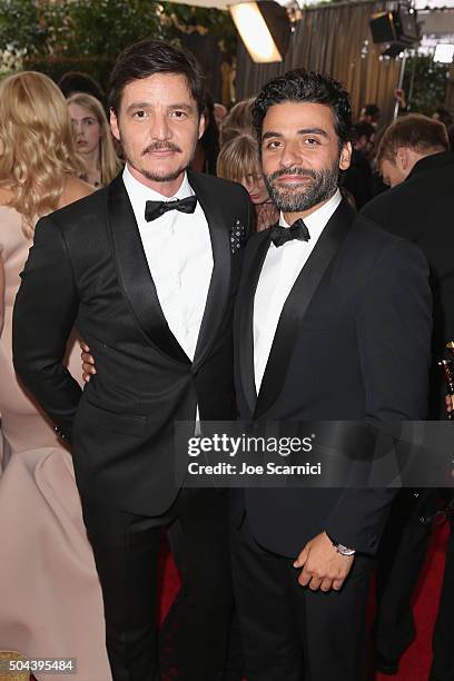 Actors Pedro Pascal and Oscar Isaac attend the 73rd Annual Golden Globe Awards held at the Beverly Hilton Hotel on January 10, 2016 in Beverly Hills,...