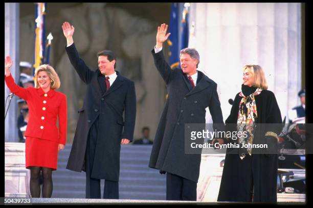 Pres. Bill & Hillary Rodham Clinton & VP Al & Tipper Gore waving in front of Lincoln Memorial in inaugural day rite.