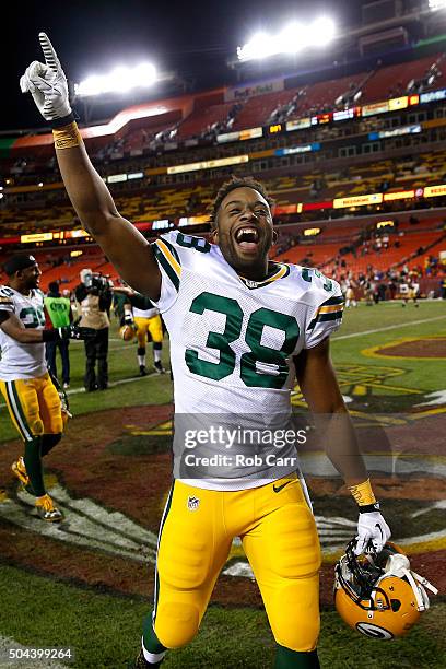Running back John Crockett of the Green Bay Packers celebrates after the Green Bay Packers defeated the Washington Redskins 35-18 during the NFC Wild...