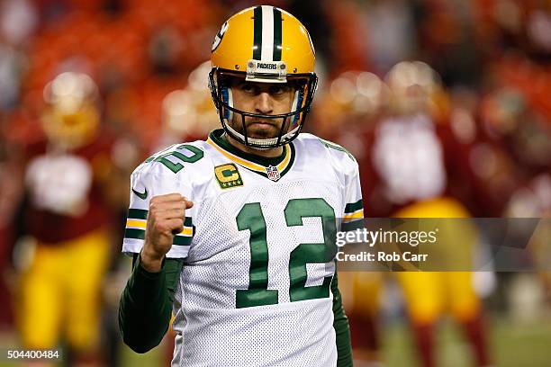 Quarterback Aaron Rodgers of the Green Bay Packers celebrates after the Green Bay Packers defeated the Washington Redskins 35-18 during the NFC Wild...