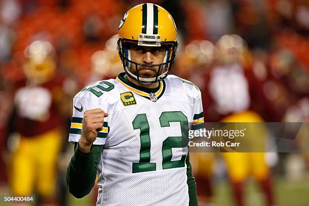Quarterback Aaron Rodgers of the Green Bay Packers celebrates after the Green Bay Packers defeated the Washington Redskins 35-18 during the NFC Wild...