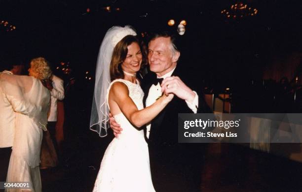 Mag. Publisher Hugh Hefner dancing w. His daughter Christie, the mag's. CEO, at her wedding to lawyer Bill Marovitz at the Four Seasons Hotel.