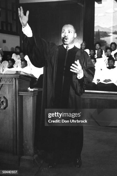 Civil Rights activist Rev. Dr. Martin Luther King Jr. Gesturing toward heaven while delivering sermon at Ebenezer Baptist Church.