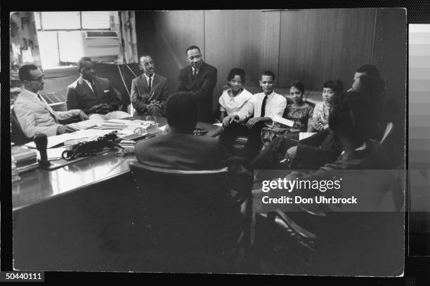 Civil Rights activist Rev. Dr. Martin Luther King Jr. Talking w. A college group of 12 male & female student sit-in organizers incl. Julian Bond...