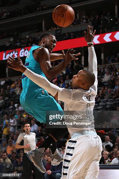Kemba Walker of the Charlotte Hornets looses control of the ball against Randy Foye of the Denver Nuggets at Pepsi Center on January 10, 2016 in...