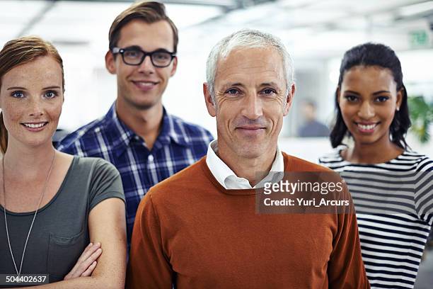 pride in his team - four people stock pictures, royalty-free photos & images