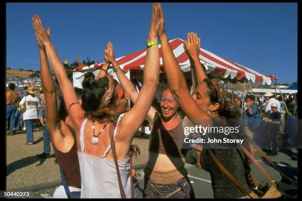 Unident. Female fans circle dancing at concert of rock band Ratdog, which was formed by former Grateful Dead guitarist Bob Weir after Jerry Garcia's...