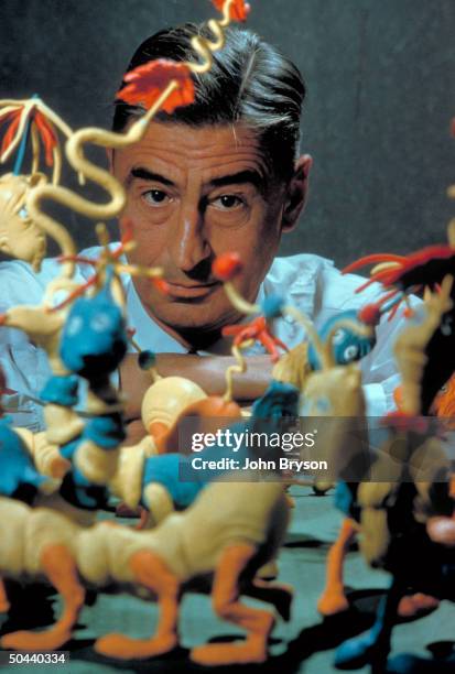 Children's book author/illustrator Theodor Seuss Geisel poses with models of some of the characters he has created.