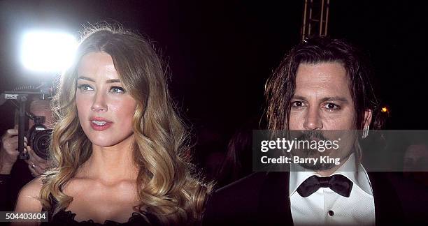 Actress Amber Heard and actor Johnny Depp arrive at the 27th Annual Palm Springs International Film Festival at Palm Springs Convention Center on...