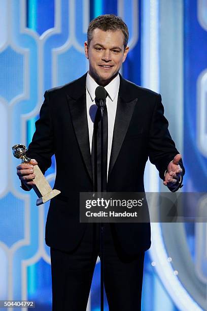 In this handout photo provided by NBCUniversal, Matt Damon accepts the award for Best Actor - Motion Picture, Comedy onstage for "The Martian" during...