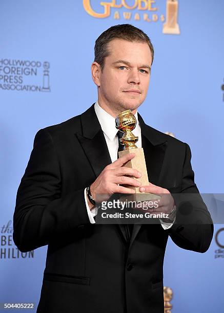 Actor Matt Damon, winner of the award for Best Performance by an Actor in a Motion Picture - Musical or Comedy for "The Martian," poses in the press...
