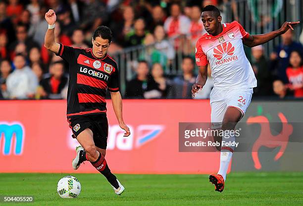 Javier Hernndez of the Bayer Leverkusen in action against Fernando Mina of the Indepediente Santa Fe during the match at the ESPN Wide World of...