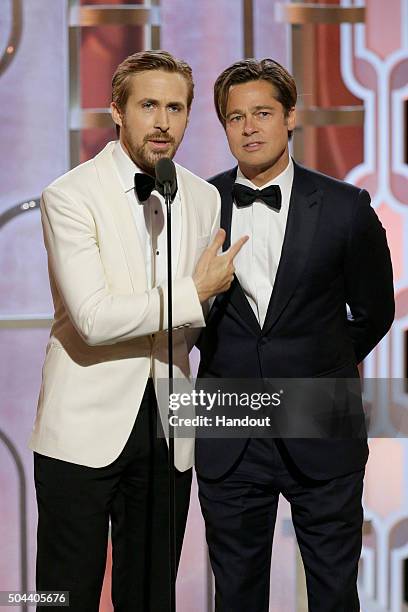 In this handout photo provided by NBCUniversal, Presenters Ryan Gosling and Brad Pitt speak onstage during the 73rd Annual Golden Globe Awards at The...