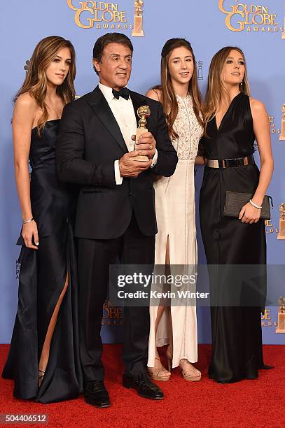 Actor Sylvester Stallone , winner of Best Supporting Performance in a Motion Picture for 'Creed,' poses in the press room with daughters Sistine,...