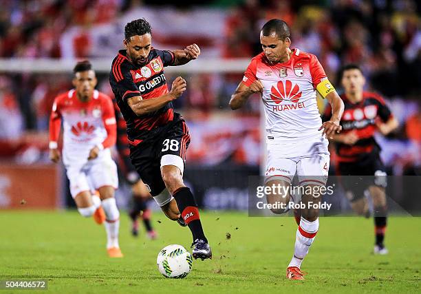 Karim Bellarabi of the Bayer Leverkusen in action against Sergio Otlvaro of the Indepediente Santa Fe during the match at the ESPN Wide World of...