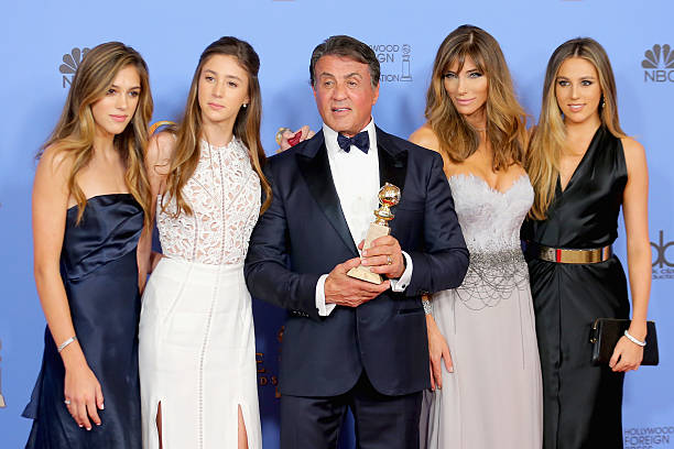 Actor Sylvester Stallone , winner of Best Supporting Performance in a Motion Picture for 'Creed,' poses in the press room with wife Jennifer Flavin...